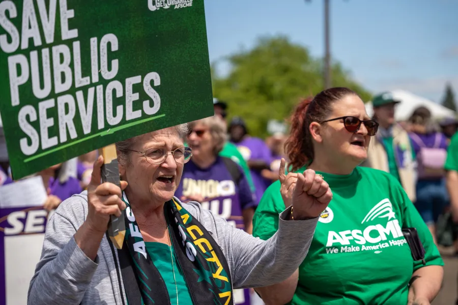 AFSCME Member Holding Sign at Rally